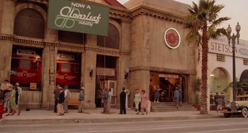 Movie still from “Who Framed Roger Rabbit” (1988), directed by Robert Zemeckis – A group of people standing on the side of the street; Wide shot, Low angle