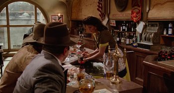 Movie still from “Who Framed Roger Rabbit” (1988), directed by Robert Zemeckis – A woman is serving a man at a bar; Wide shot, High angle