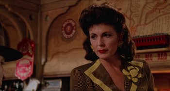 Movie still from “Who Framed Roger Rabbit” (1988), directed by Robert Zemeckis – A person wearing a suit; Close Up shot, Over the shoulder angle