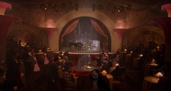 Movie still from “Who Framed Roger Rabbit” (1988), directed by Robert Zemeckis – People are sitting at tables in front of a stage with a piano; Extreme Wide shot, High angle