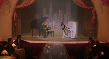 Movie still from “Who Framed Roger Rabbit” (1988), directed by Robert Zemeckis – A stage with a piano and two people sitting at the piano; Wide shot, High angle