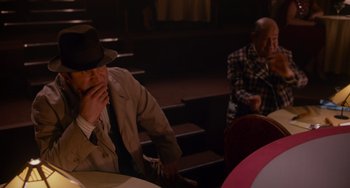 Movie still from “Who Framed Roger Rabbit” (1988), directed by Robert Zemeckis – Two men sitting at a table in front of each other; Medium shot, Over the shoulder angle