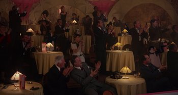 Movie still from “Who Framed Roger Rabbit” (1988), directed by Robert Zemeckis – A group of people sitting at tables clapping; Wide shot, High angle