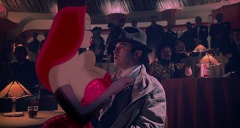 Movie still from “Who Framed Roger Rabbit” (1988), directed by Robert Zemeckis – A man standing next to an animated character; Medium shot, Over the shoulder angle