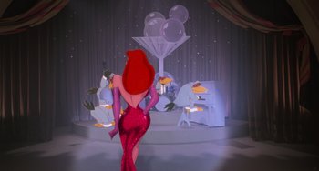 Movie still from “Who Framed Roger Rabbit” (1988), directed by Robert Zemeckis – A woman in a red dress standing in front of a stage; Wide shot, Low angle