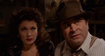 Movie still from “Who Framed Roger Rabbit” (1988), directed by Robert Zemeckis – A man and a woman pose for a picture; Close Up shot, High angle
