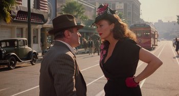 Movie still from “Who Framed Roger Rabbit” (1988), directed by Robert Zemeckis – A man and a woman talking on the street; Medium shot, Over the shoulder angle