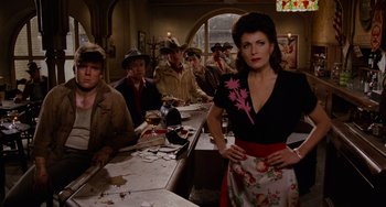 Movie still from “Who Framed Roger Rabbit” (1988), directed by Robert Zemeckis – A group of people sitting at a long table; Medium shot, Low angle