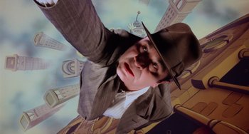 Movie still from “Who Framed Roger Rabbit” (1988), directed by Robert Zemeckis – A man wearing a suit and a hat; Medium shot, Overhead angle