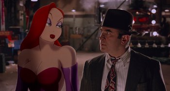 Movie still from “Who Framed Roger Rabbit” (1988), directed by Robert Zemeckis – A man in a suit standing next to a woman in a red dress; Close Up shot, Over the shoulder angle