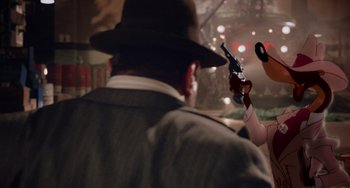 Movie still from “Who Framed Roger Rabbit” (1988), directed by Robert Zemeckis – A man in a hat holding a gun in his hand; Close Up shot, Over the shoulder angle