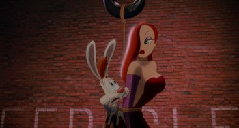 Movie still from “Who Framed Roger Rabbit” (1988), directed by Robert Zemeckis – A woman and a rabbit are standing next to a brick wall; Medium shot, Low angle
