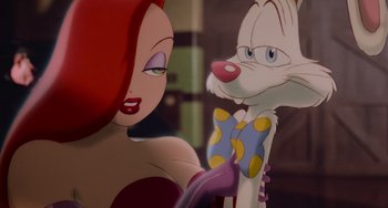 Movie still from “Who Framed Roger Rabbit” (1988), directed by Robert Zemeckis – A woman with red hair is looking at an animated character; Close Up shot, Over the shoulder angle