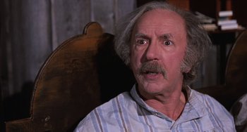 Movie still from “Willy Wonka & the Chocolate Factory” (1971), directed by Mel Stuart – An older man with a mustache and a mustache comb; Close Up shot, Low angle