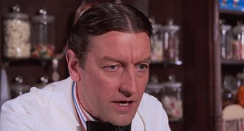 Movie still from “Willy Wonka & the Chocolate Factory” (1971), directed by Mel Stuart – A person wearing a bow tie; Close Up shot, Low angle