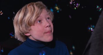 Movie still from “Willy Wonka & the Chocolate Factory” (1971), directed by Mel Stuart – A young boy is looking up at the sky with bubbles; Close Up shot, Low angle