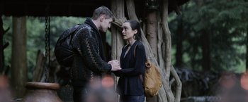 Movie still from “Winnie the Pooh: Blood and Honey” (2023), directed by Rhys Frake-Waterfield – A man and a woman standing next to each other; Medium shot, Over the shoulder angle