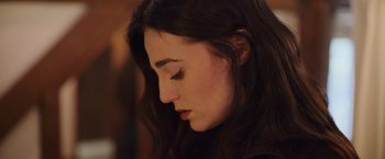 Movie still from “Winnie the Pooh: Blood and Honey” (2023), directed by Rhys Frake-Waterfield – A person with long hair; Close Up shot, Over the shoulder angle