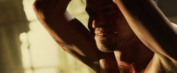 Movie still from “Winnie the Pooh: Blood and Honey” (2023), directed by Rhys Frake-Waterfield – A person with blood all over his body; Close Up shot, Over the shoulder angle