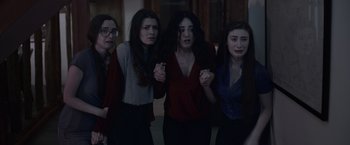 Movie still from “Winnie the Pooh: Blood and Honey” (2023), directed by Rhys Frake-Waterfield – A group of women standing next to each other; Medium shot, High angle