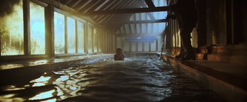 Movie still from “Winnie the Pooh: Blood and Honey” (2023), directed by Rhys Frake-Waterfield – A person is swimming in a pool of water; Extreme Wide shot, High angle