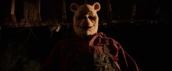 Movie still from “Winnie the Pooh: Blood and Honey” (2023), directed by Rhys Frake-Waterfield – The face of a character; Close Up shot, Low angle