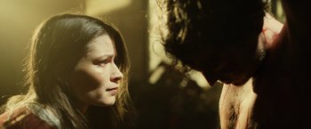 Movie still from “Winnie the Pooh: Blood and Honey” (2023), directed by Rhys Frake-Waterfield – A woman standing next to another woman in a room; Extreme Close Up shot, Over the shoulder angle