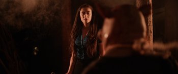 Movie still from “Winnie the Pooh: Blood and Honey” (2023), directed by Rhys Frake-Waterfield – A woman standing in front of a bathroom mirror; Close Up shot, Low angle