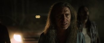 Movie still from “Winnie the Pooh: Blood and Honey” (2023), directed by Rhys Frake-Waterfield – A person with long hair; Close Up shot, Over the shoulder angle