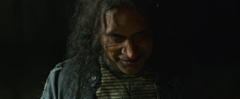 Movie still from “Winnie the Pooh: Blood and Honey” (2023), directed by Rhys Frake-Waterfield – A person with long black hair; Close Up shot, Low angle