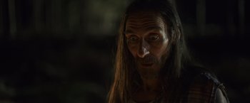 Movie still from “Winnie the Pooh: Blood and Honey” (2023), directed by Rhys Frake-Waterfield – A person with long hair; Close Up shot, Low angle