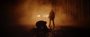 Movie still from “Winnie the Pooh: Blood and Honey” (2023), directed by Rhys Frake-Waterfield – Two people in the water in the fog; Wide shot, Low angle