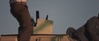 Movie still from “Wolf Hound” (2022), directed by Michael B. Chait – View of the top of a vehicle; Medium shot, Low angle