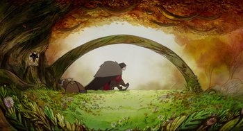 Movie still from “Wolfwalkers” (2020), directed by Ross Stewart – A man sitting on the ground under a tree; Wide shot, Low angle