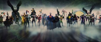 Movie still from “Wonder Woman” (2017), directed by Patty Jenkins – A group of people standing in the fog with their hands on their hips; Extreme Wide shot, High angle