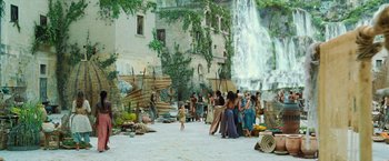 Movie still from “Wonder Woman” (2017), directed by Patty Jenkins – A group of people standing around a waterfall; Extreme Wide shot, High angle