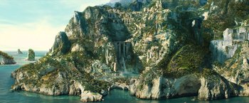 Movie still from “Wonder Woman” (2017), directed by Patty Jenkins – An image of a waterfall in the middle of a mountain; Extreme Wide shot, High angle