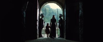 Movie still from “Wonder Woman” (2017), directed by Patty Jenkins – A group of people standing in front of an archway; Wide shot, Low angle