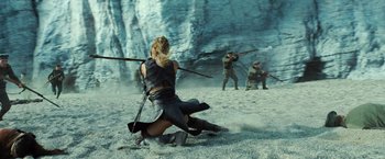 Movie still from “Wonder Woman” (2017), directed by Patty Jenkins – A group of people are fighting in the sand; Wide shot, High angle
