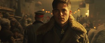 Movie still from “Wonder Woman” (2017), directed by Patty Jenkins – A person wearing a military uniform; Close Up shot, Over the shoulder angle