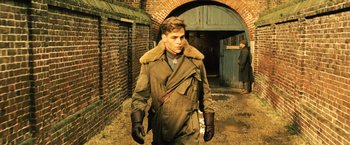 Movie still from “Wonder Woman” (2017), directed by Patty Jenkins – A young man in an army jacket and gloves; Medium shot, Low angle