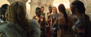 Movie still from “Wonder Woman” (2017), directed by Patty Jenkins – A group of people dressed in ancient roman clothing; Medium shot, Over the shoulder angle