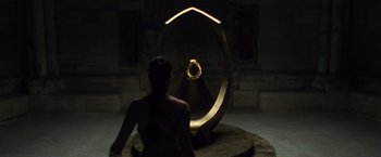 Movie still from “Wonder Woman” (2017), directed by Patty Jenkins – A woman sitting in front of a mirror; Extreme Wide shot, High angle