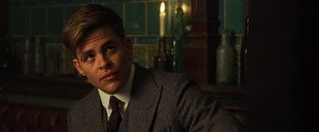 Movie still from “Wonder Woman” (2017), directed by Patty Jenkins – A man in a suit and tie; Close Up shot, Over the shoulder angle