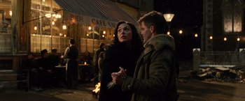 Movie still from “Wonder Woman” (2017), directed by Patty Jenkins – A man and a woman standing next to each other; Medium shot, Low angle