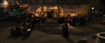 Movie still from “Wonder Woman” (2017), directed by Patty Jenkins – A group of people standing in front of a building; Extreme Wide shot, High angle
