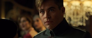 Movie still from “Wonder Woman” (2017), directed by Patty Jenkins – A person wearing a military uniform; Close Up shot, Over the shoulder angle