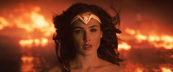 Movie still from “Wonder Woman” (2017), directed by Patty Jenkins – A person wearing a headband; Close Up shot, Over the shoulder angle
