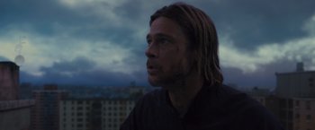 Movie still from “World War Z” (2013), directed by Marc Forster – A person with long blond hair; Close Up shot, Low angle
