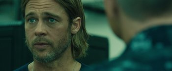 Movie still from “World War Z” (2013), directed by Marc Forster – A person with long hair; Close Up shot, Over the shoulder angle